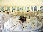 Set tables in Wedding Marquee